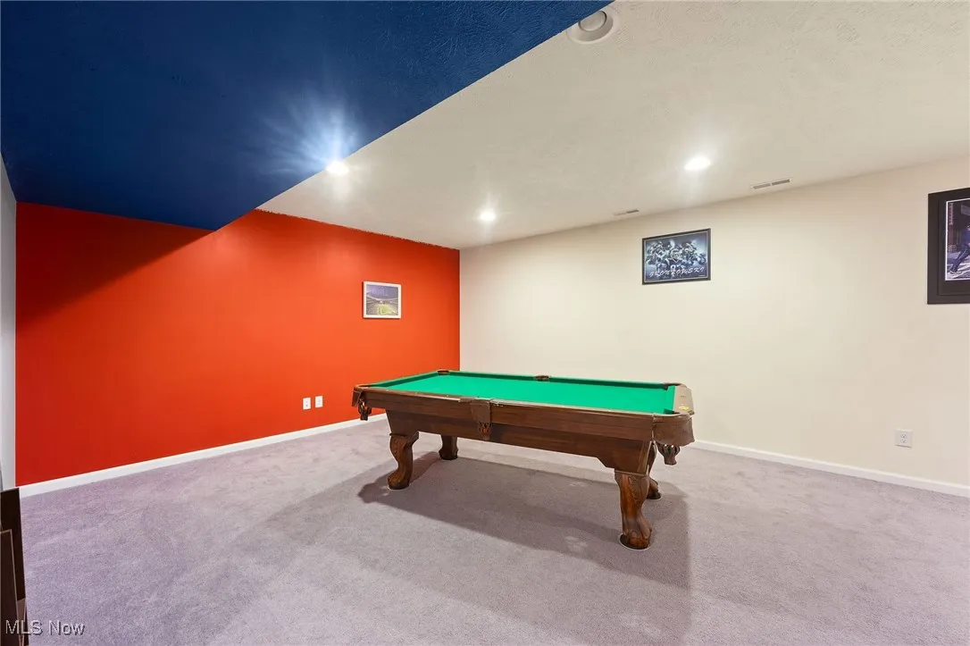 Basement Bathroom with toilet, washtub / shower combination, and vanity