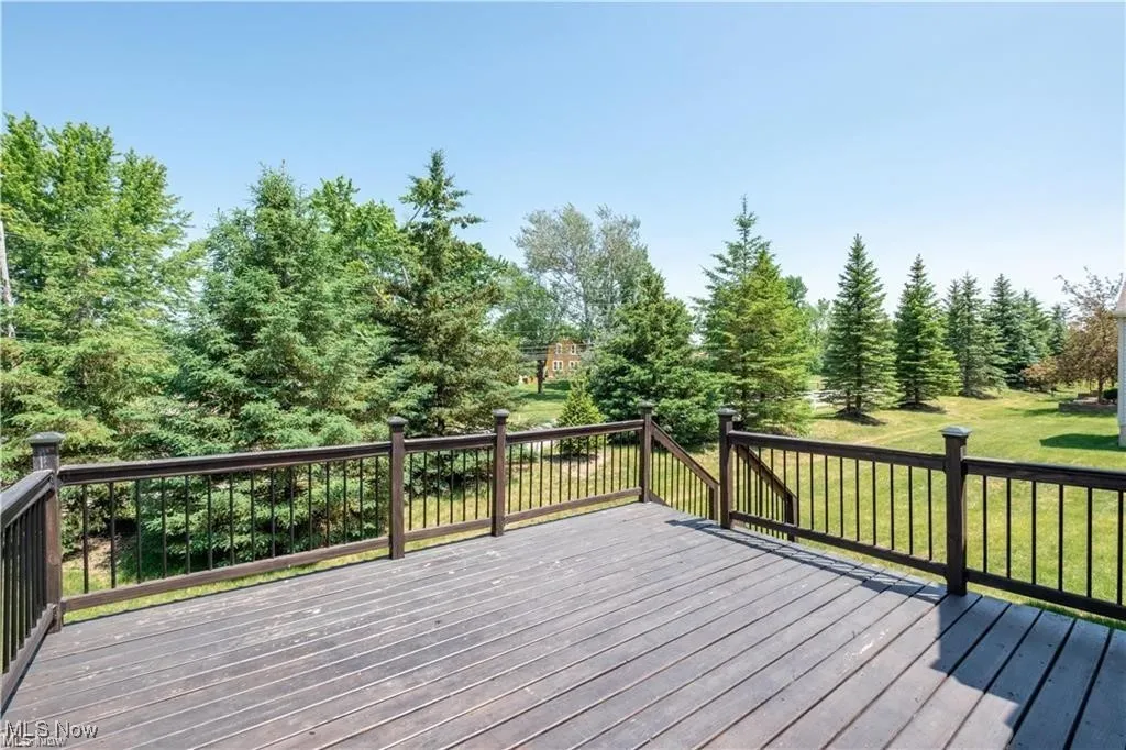 Wooden deck featuring a lawn