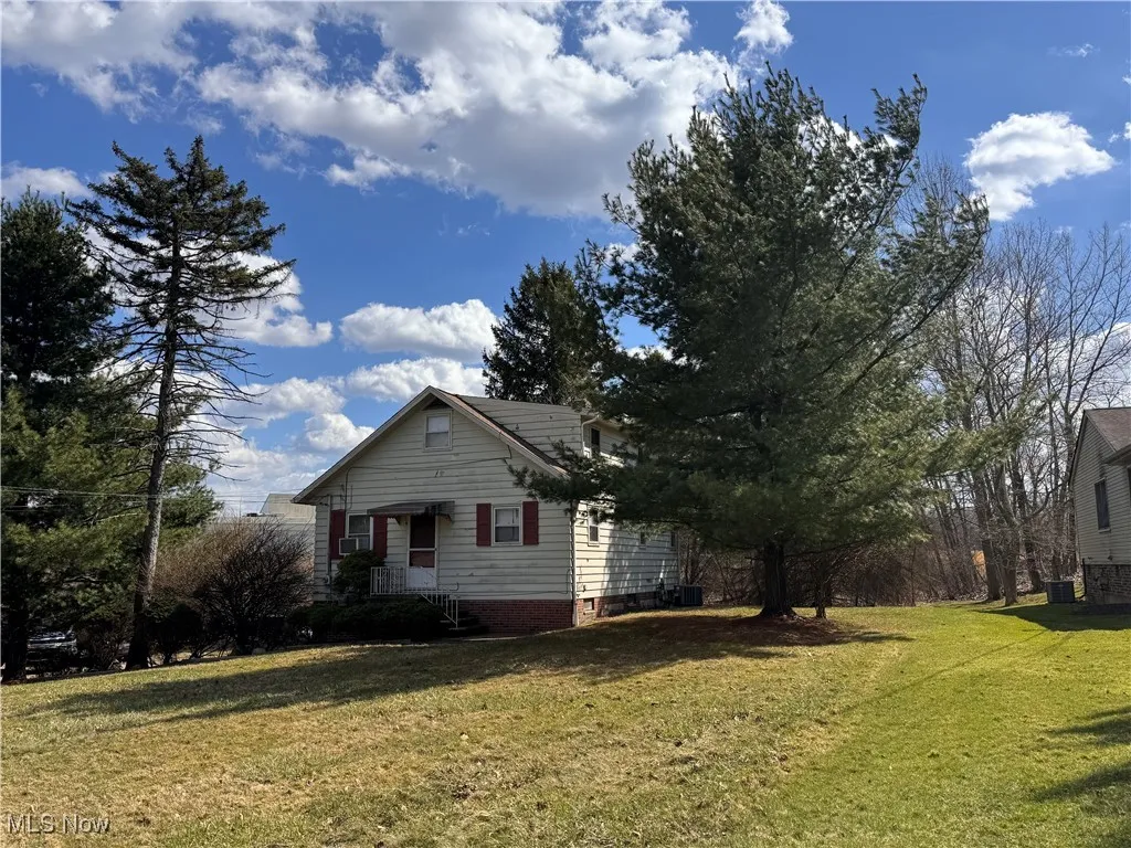 View of home's exterior featuring a lawn