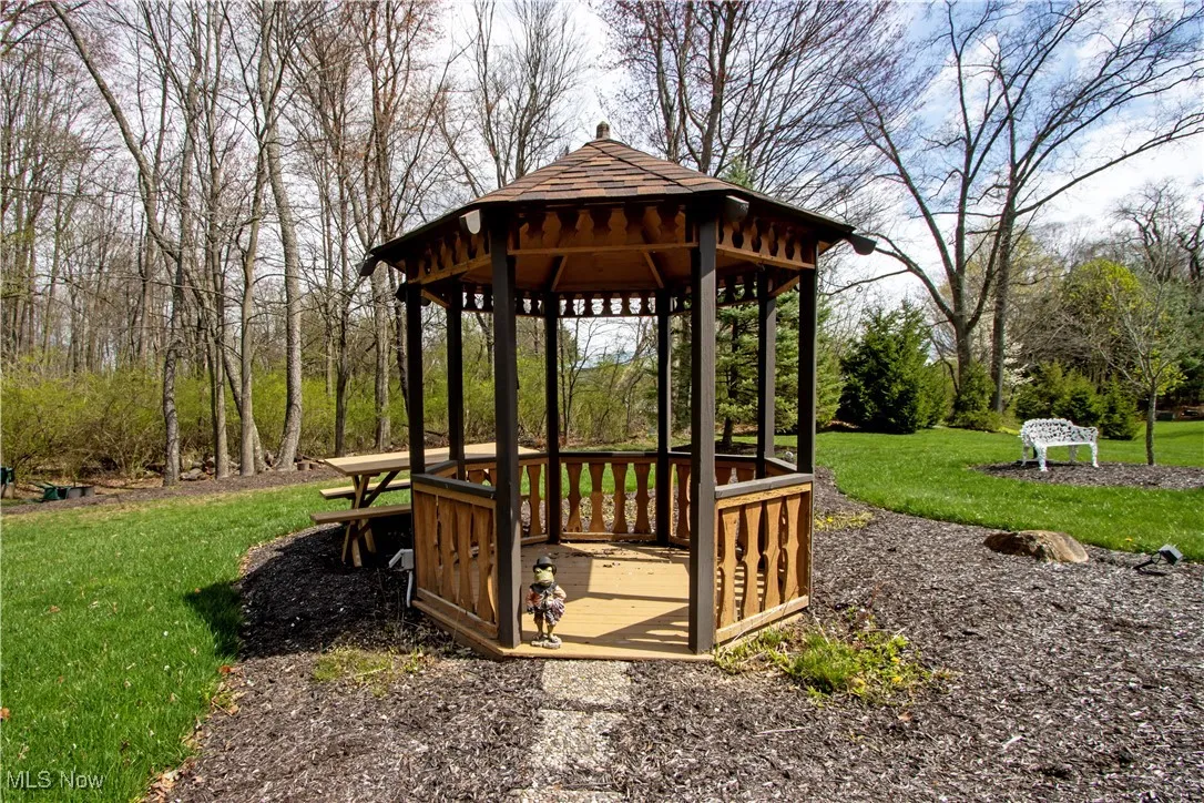 View of community with a lawn and a gazebo