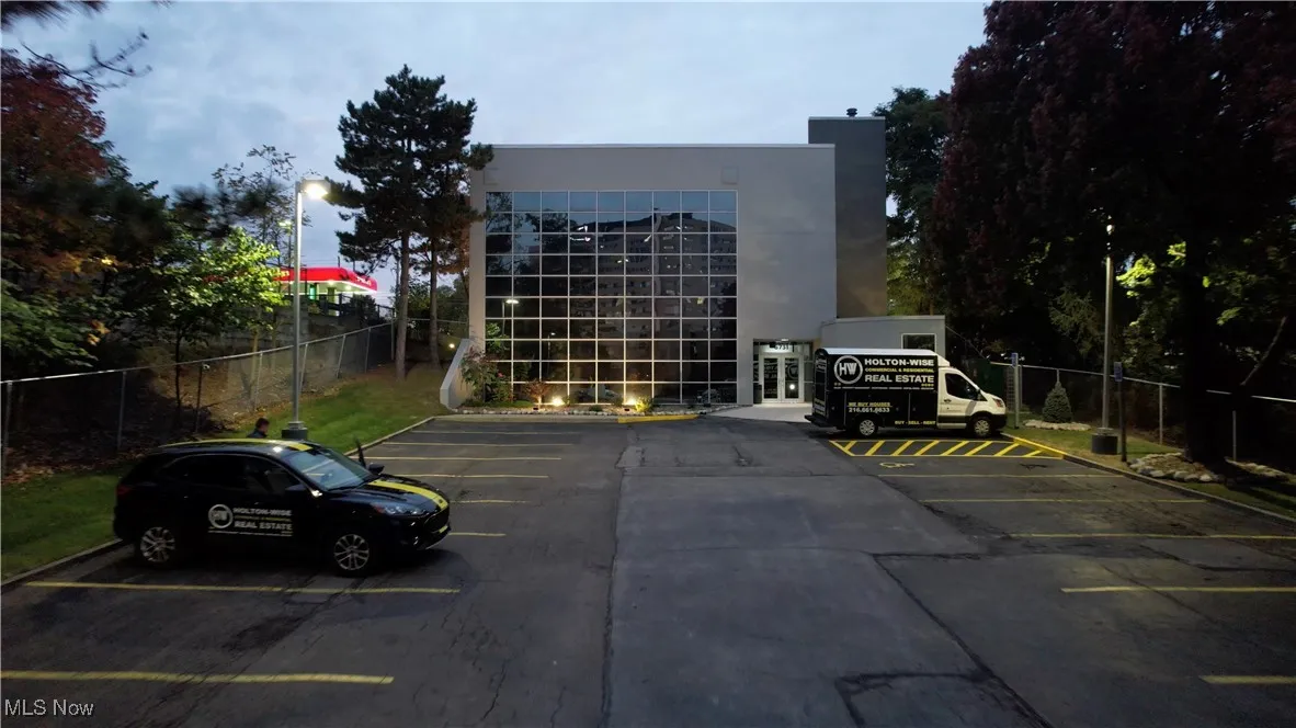 Uncovered parking lot with fence