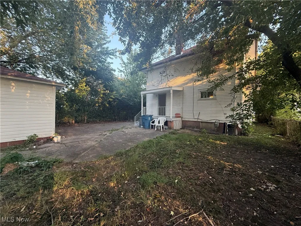 Back of property with a patio