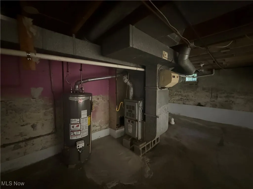 Basement with gas water heater and heating unit