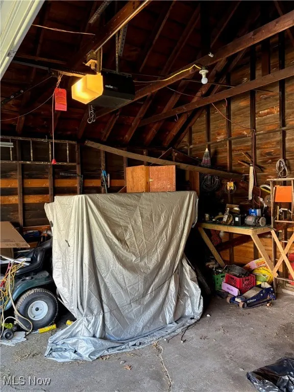 Garage featuring a garage door opener