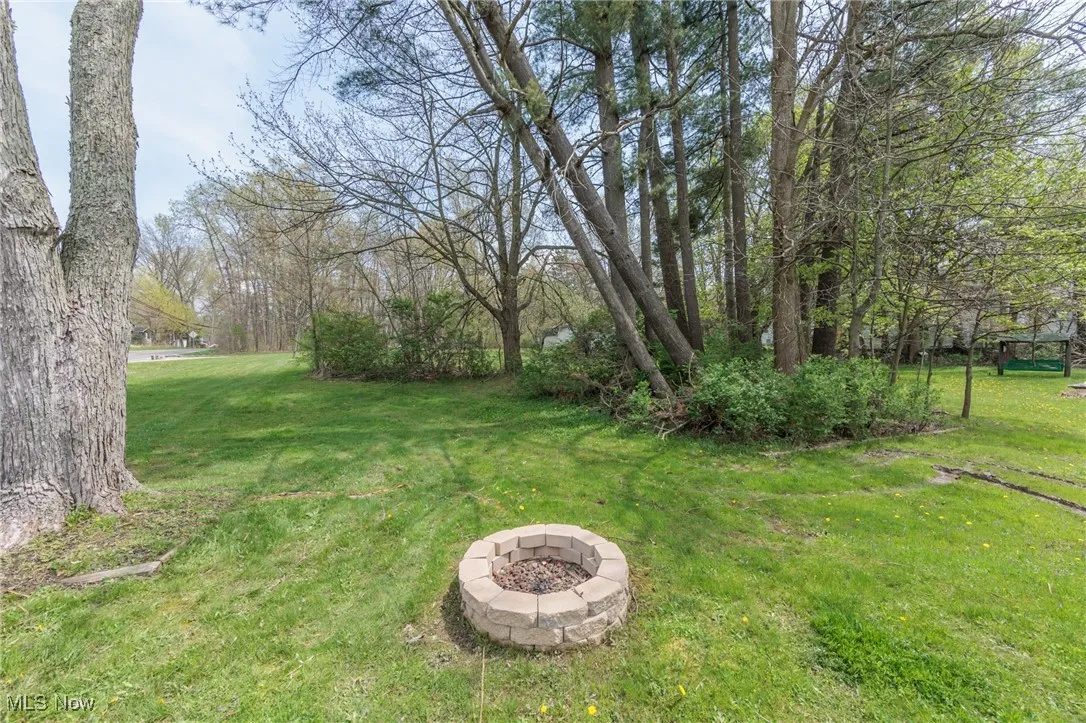 View of yard featuring a fire pit