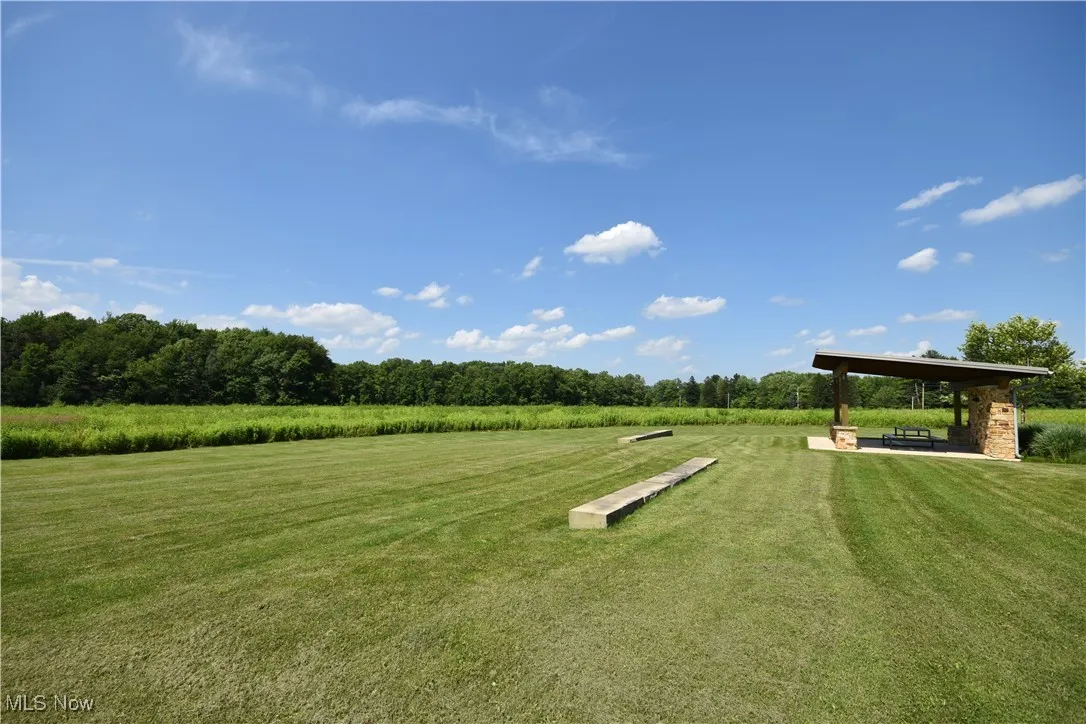 View of property's community featuring a lawn