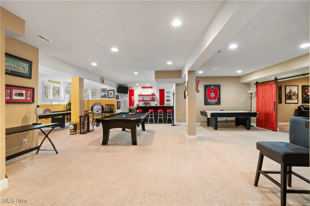Recreation room with recessed lighting and pool table