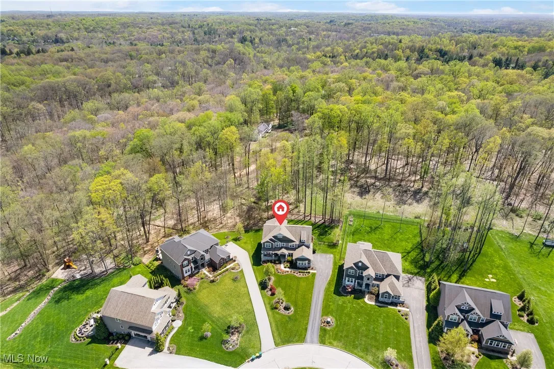 Aerial view with a residential view and a wooded view