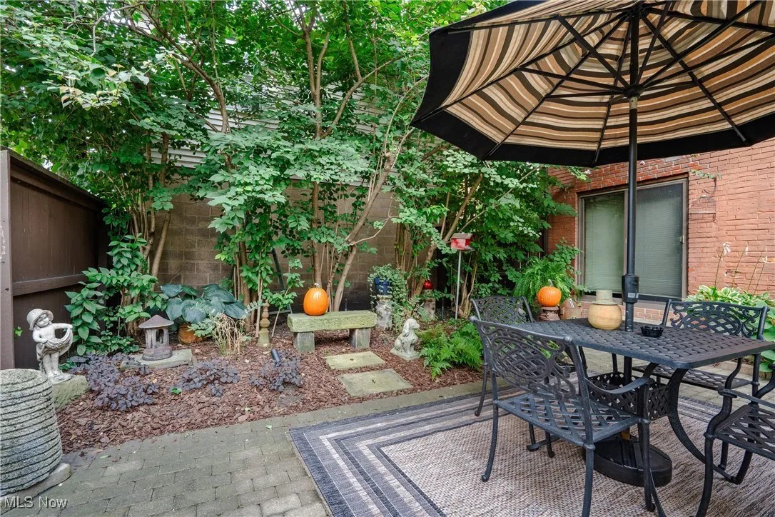 View of patio with fence private yard and outdoor dining space
