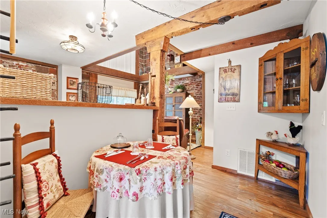 Dining area in rear unit with original beamed ceiling