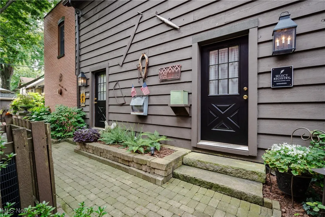 View of the entrance to the rear unit and the middle unit/common area that is currently being used for catering services, storage, and laundry services for the B&B