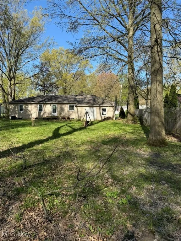 View of yard featuring fence
