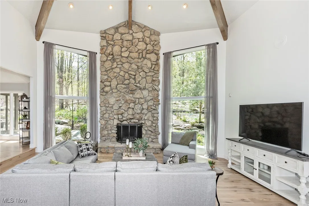 Great Room adjoins Dining Room ~ all main floor rooms unified by new hardwood flooring.