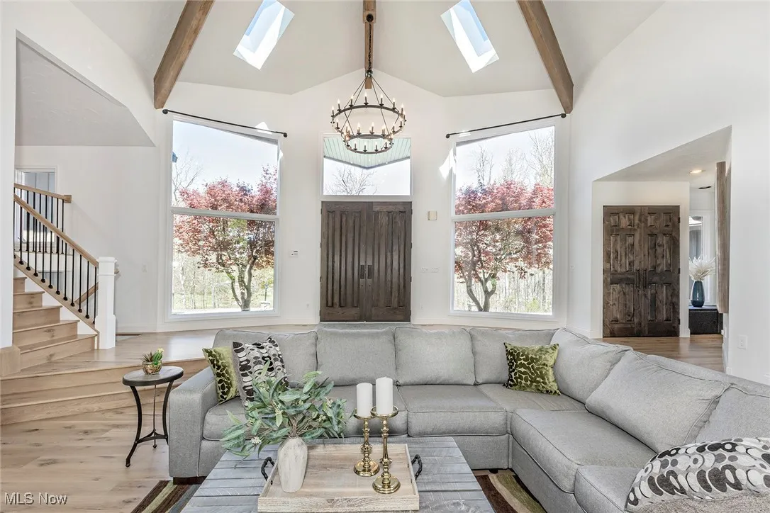 Entry to Great Room with twin skylights in the beamed, vaulted ceilings.
