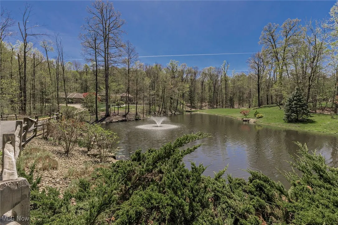 This view shows the long driveway to reach the house, nestled in a spot of idyllic privacy.