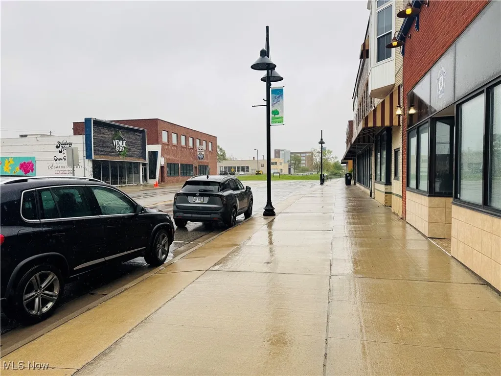 View of road with street lights and sidewalks