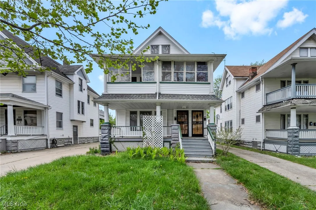 American foursquare style home with a porch