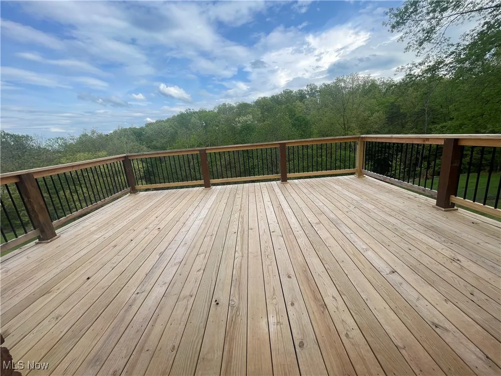 Wooden terrace with a wooded view