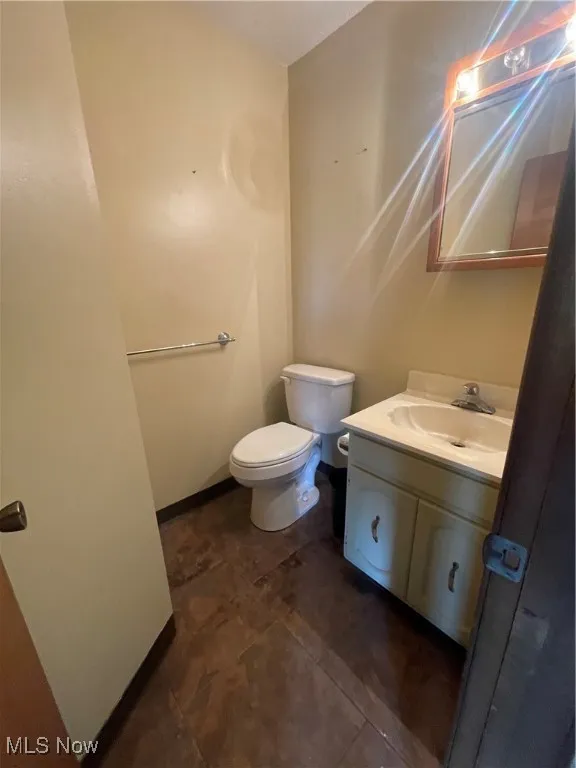 Main Floor 1/2 Bathroom with vanity and toilet
