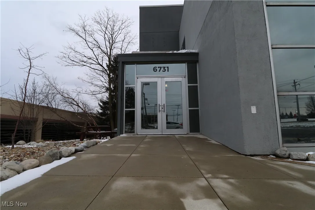 Property entrance featuring french doors and stucco siding