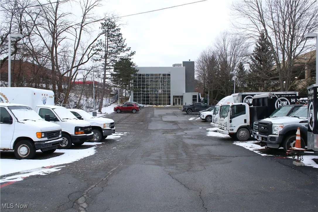 Snow covered parking featuring uncovered parking