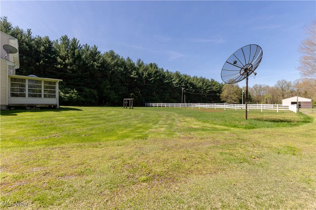 View of yard featuring fence
