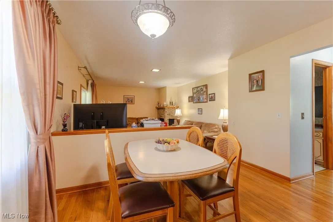 Dining area featuring baseboards and light wood-style flooring