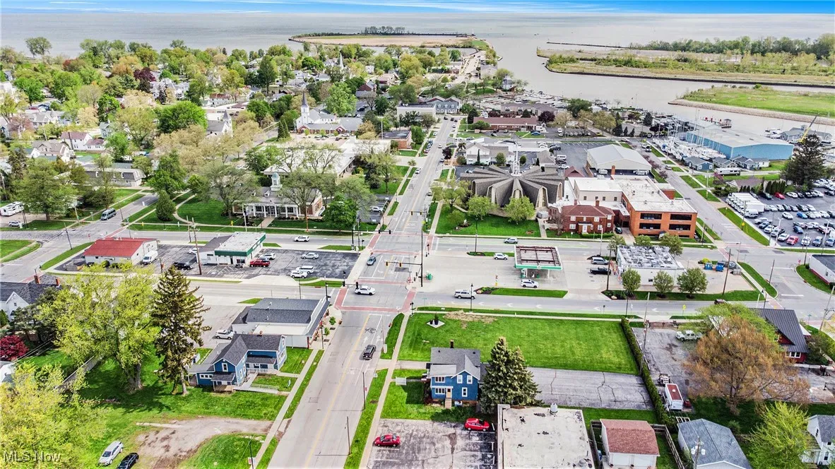 Drone / aerial view with a residential view and a water view