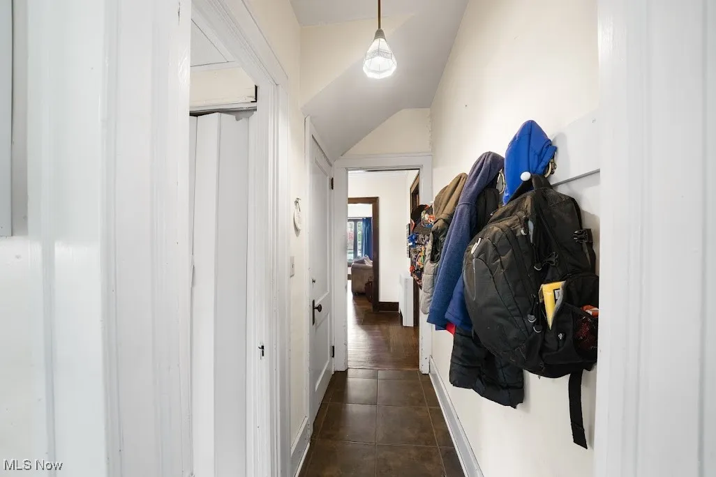 Corridor featuring baseboards