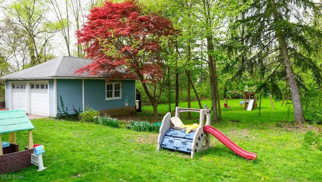 View of playground with a yard