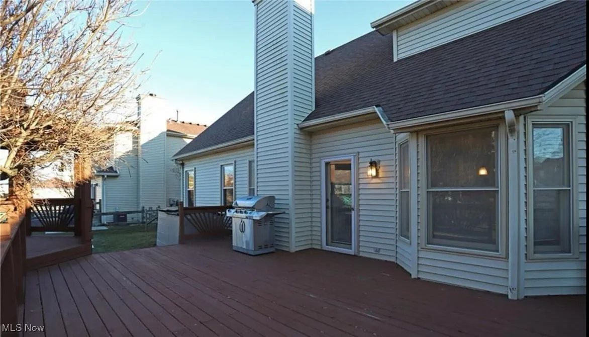 Wooden deck with a grill