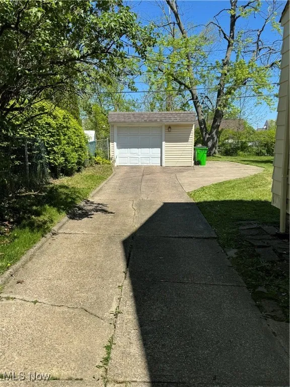 Detached garage featuring driveway