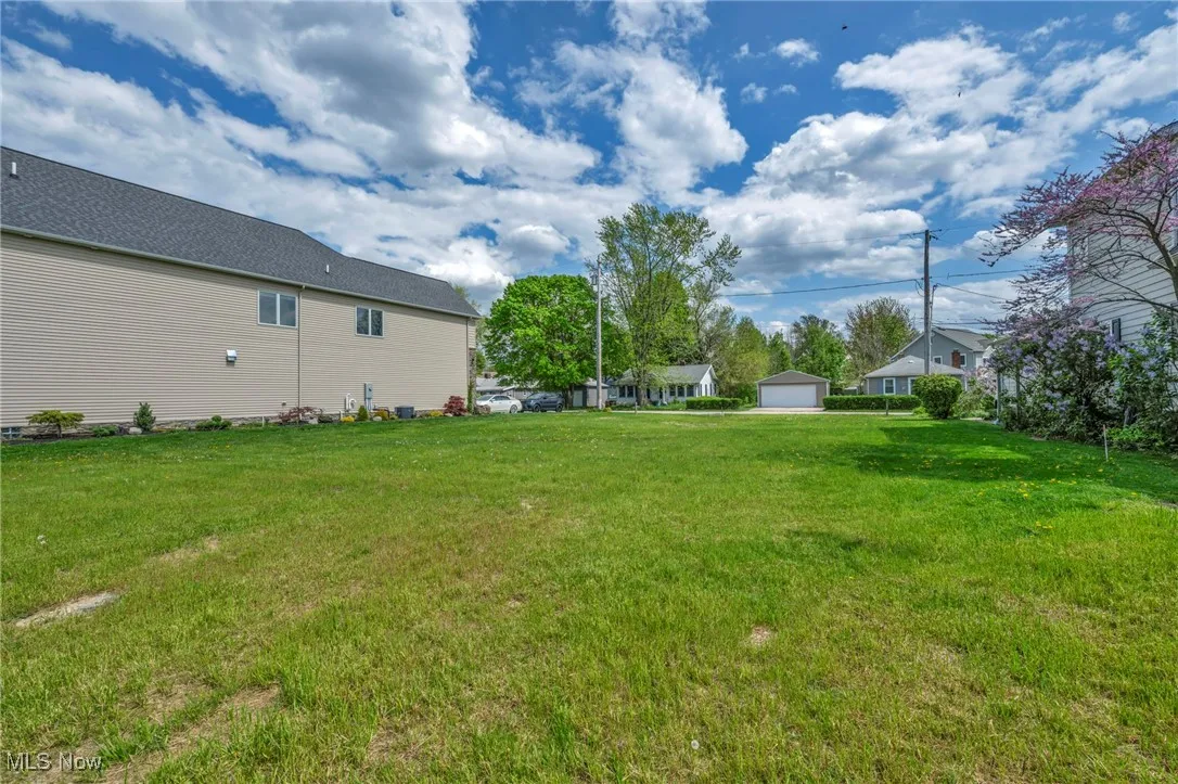 View of yard featuring a garage