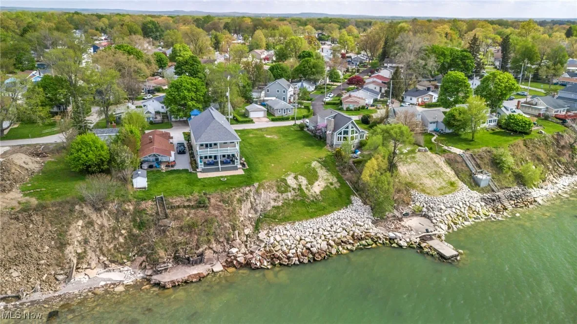 Drone / aerial view featuring a water view and a residential view