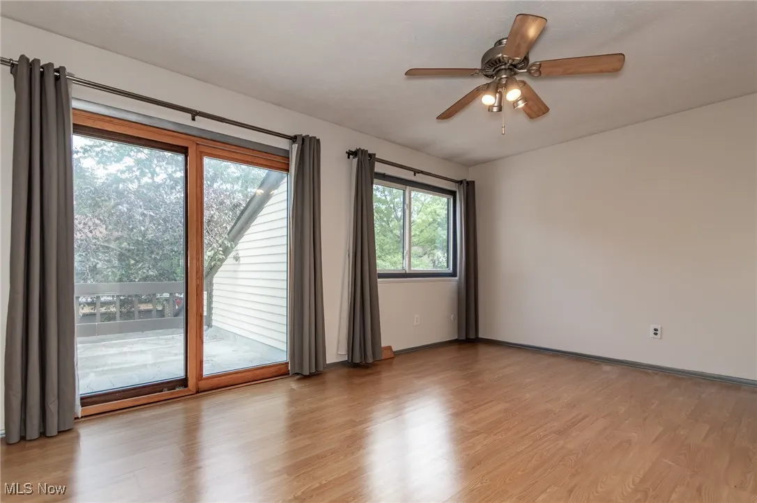 Spare room with light wood-style floors and ceiling fan