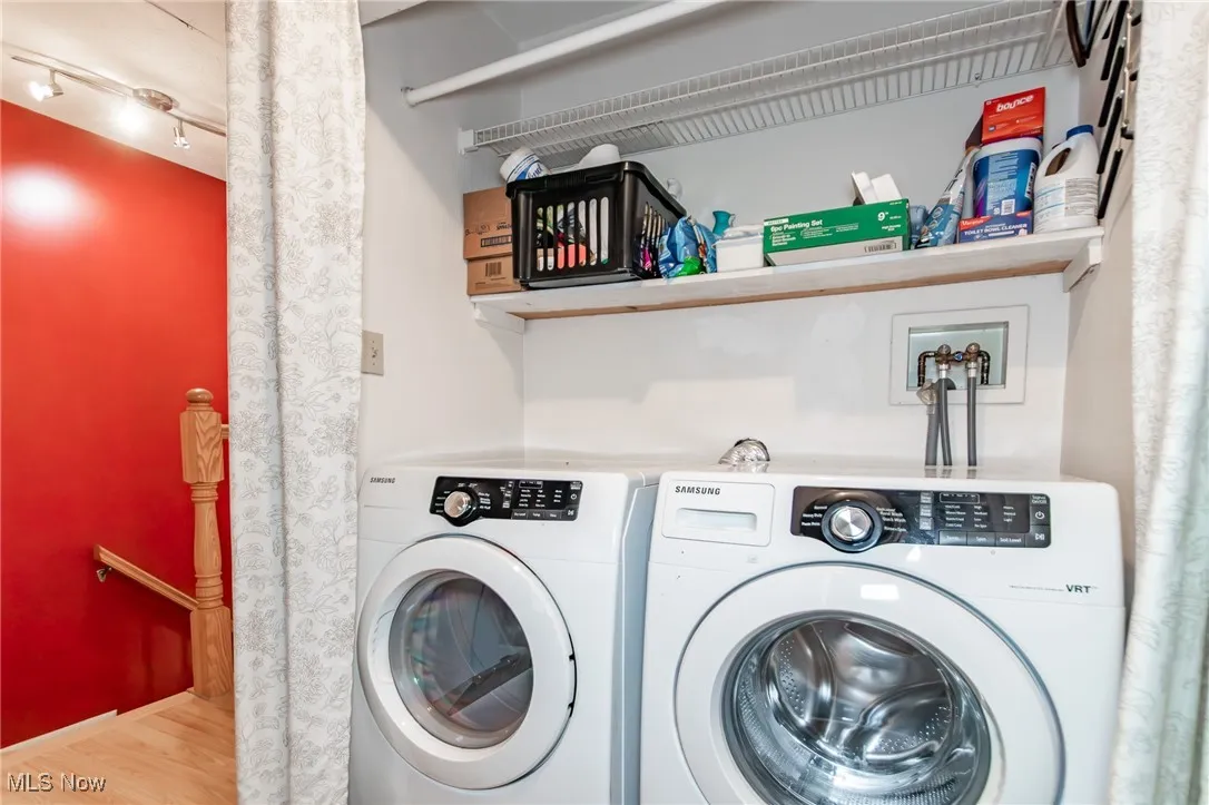 Laundry room with washer and clothes dryer