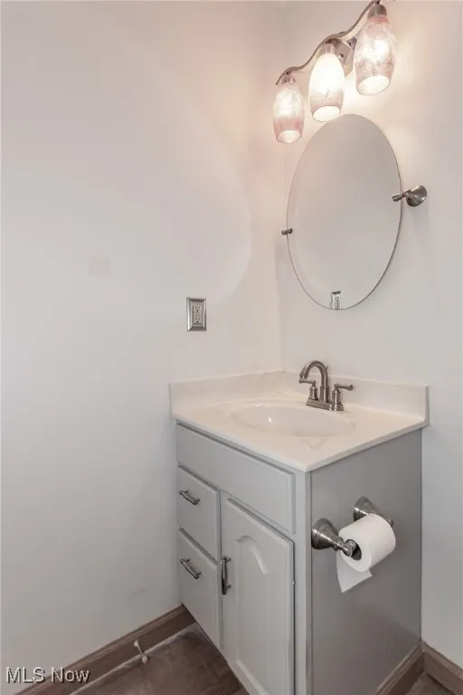 Bathroom featuring vanity and wood finished floors