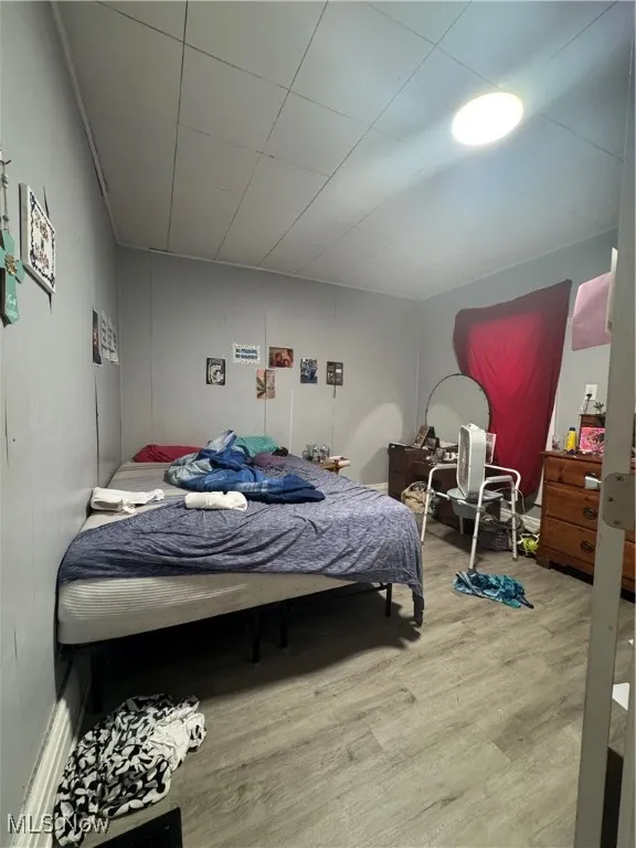 Bedroom featuring wood finished floors