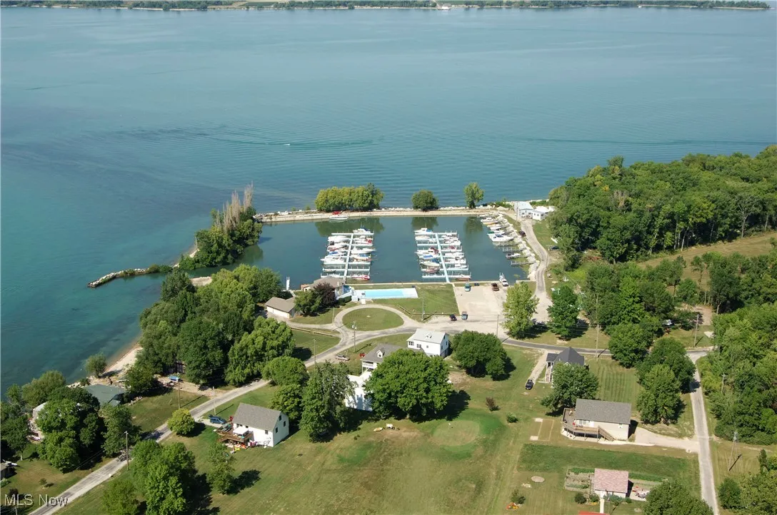 Birds eye view of property with a water view