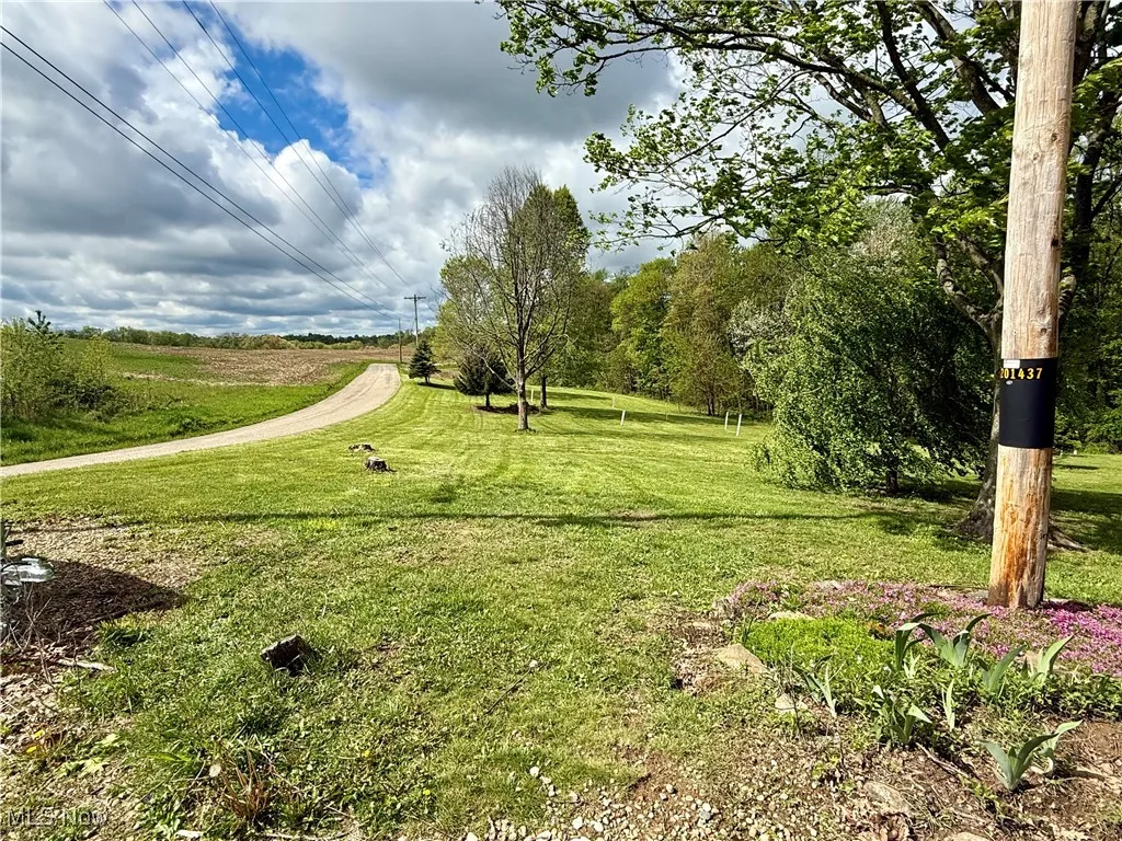 View of home's community featuring a lawn