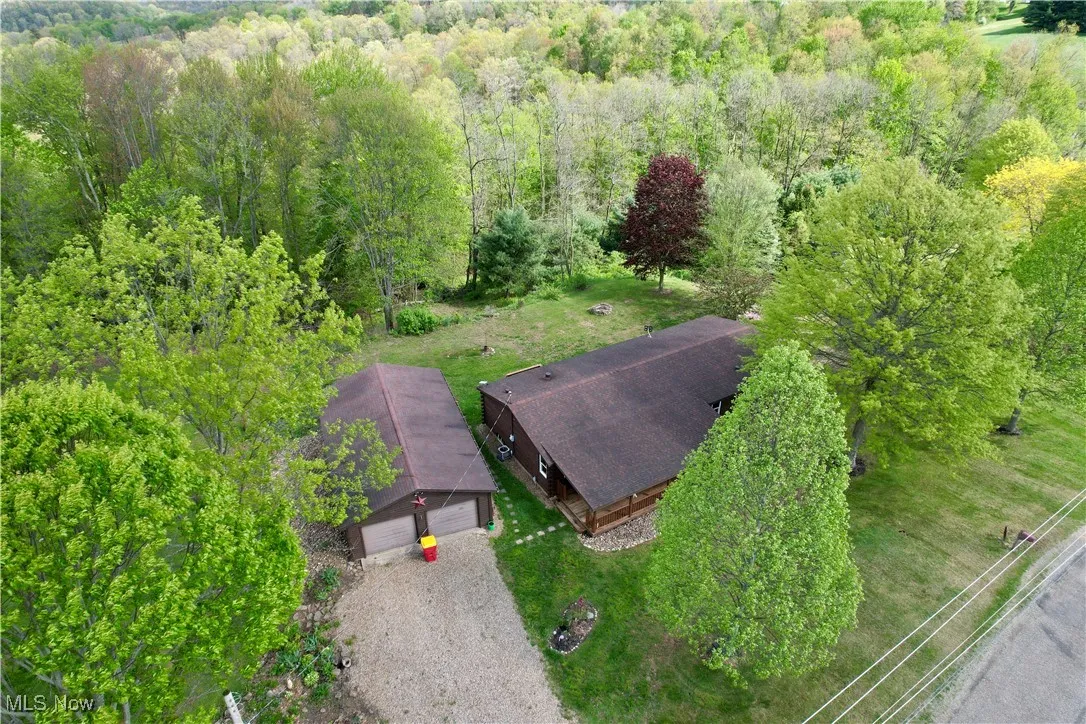 View from above of property with a forest