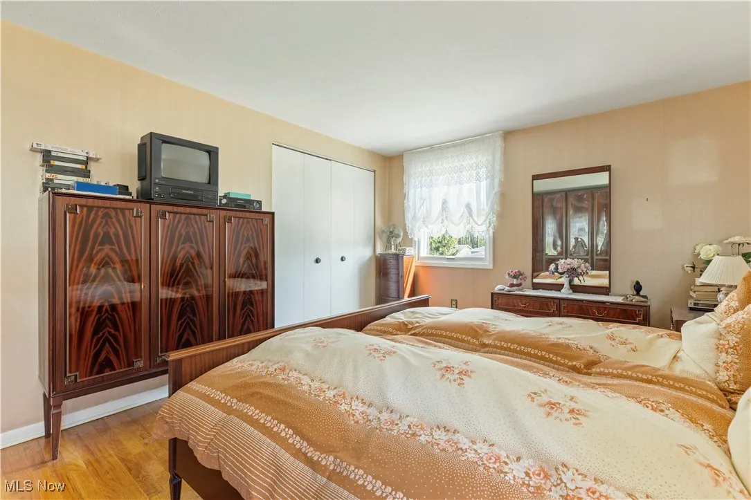 Bedroom featuring a closet and wood finished floors