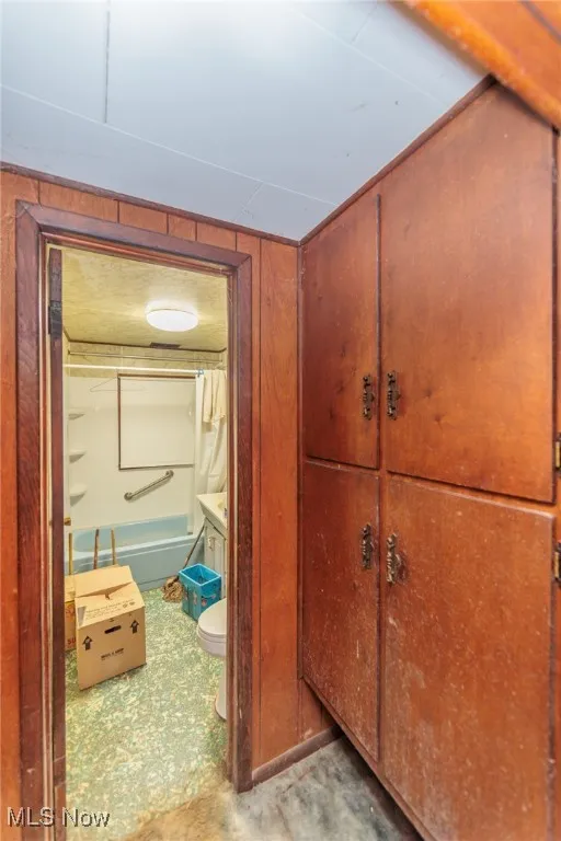Hall featuring wood walls