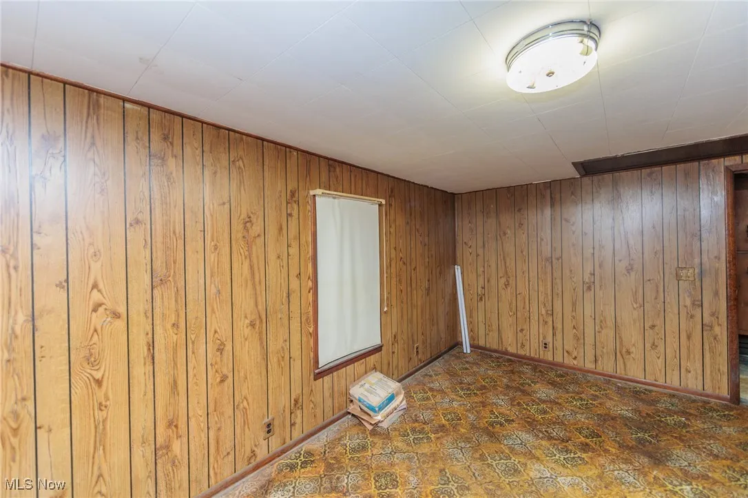Spare room with wooden walls