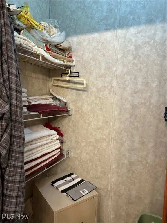 Closet in primary bathroom