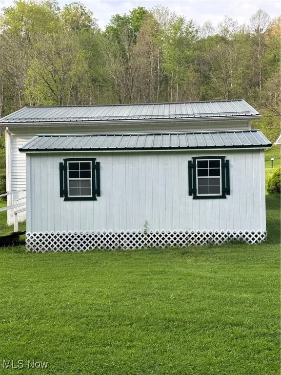 View of outbuilding behind the garage
