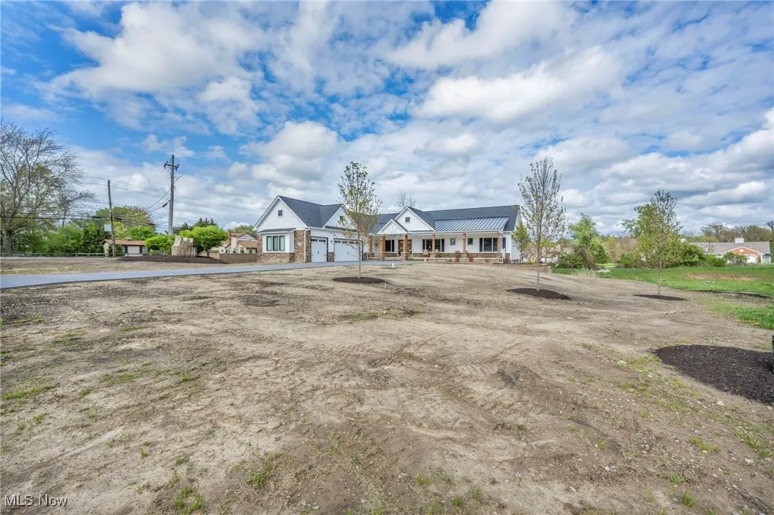 View of front of home featuring metal roof