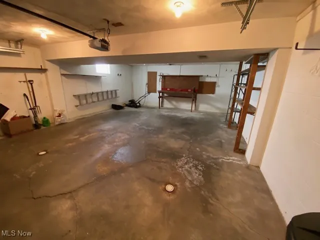 Garage featuring a garage door opener