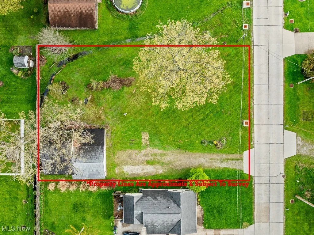 Aerial overview of property's location with property parcel outlined