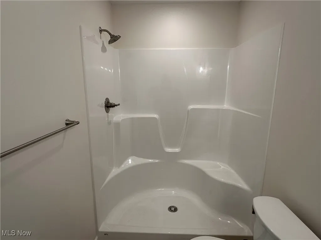 Bathroom with toilet and a shower